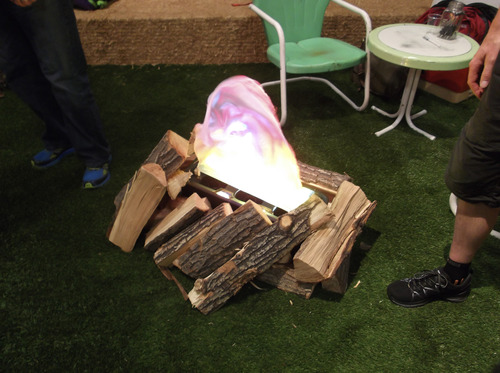 Sean P. Means  |  The Salt Lake Tribune
Want to emulate the outdoors in a cavernous convention hall? The JanSport booth at the Outdoor Retailer Summer Market at the Salt Palace resorted to an artificial campfire on fake turf.