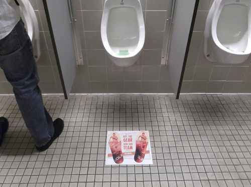 Sean P. Means  |  The Salt Lake Tribune
Some companies will advertise anywhere -- even the men's room -- at the Outdoor Retailers Summer Market at the Salt Palace.