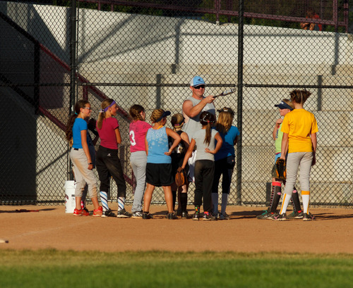 Trent Nelson  |  The Salt Lake Tribune
The West Valley Storm, a girls' softball team, practices under the direction of coach Aaron Lewis in 97 degree sunshine at the West Valley City Family Fitness Center, Wednesday July 31, 2013.