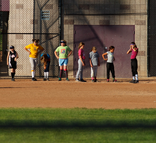 Trent Nelson  |  The Salt Lake Tribune
The West Valley Storm, a girls' softball team, practices in 97 degree sunshine at the West Valley City Family Fitness Center, Wednesday July 31, 2013.