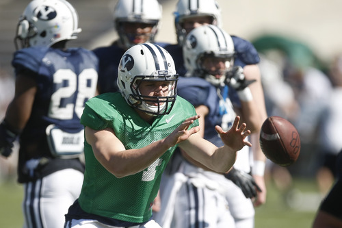 Chris Detrick  |  The Salt Lake Tribune
Brigham Young Cougars quarterback Taysom Hill (4) during the spring scrimmage at LaVell Edwards Stadium Saturday March 30, 2013.