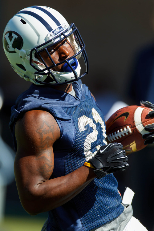 Trent Nelson  |  The Salt Lake Tribune
Jamaal Williams with the ball at BYU football practice in Provo Saturday August 3, 2013.