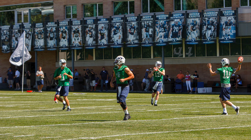 Trent Nelson  |  The Salt Lake Tribune
Quarterbacks warm up at BYU football practice in Provo Saturday August 3, 2013.