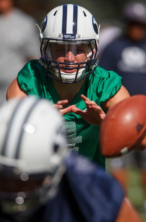 Trent Nelson  |  The Salt Lake Tribune
Taysom Hill takes the snap at BYU football practice in Provo Saturday August 3, 2013.