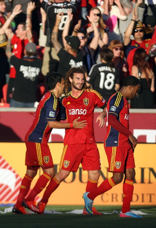 Kim Raff  |  The Salt Lake Tribune
(middle) Real Salt Lake midfielder Kyle Beckerman (5) celebrates scoring the first goal of the game with teammates (left) Real Salt Lake midfielder Javier Morales (11) and (right) Real Salt Lake forward Robbie Findley (10) putting RSL ahead at the half during a game at Rio Tinto Stadium in Sandy on June 22, 2013.