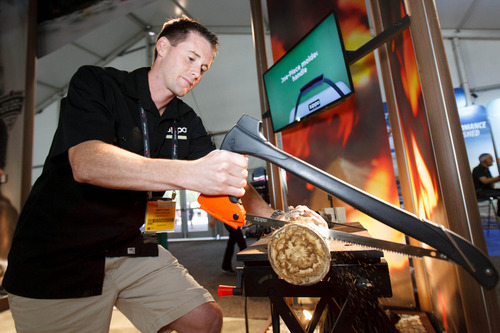 Trent Nelson  |  The Salt Lake Tribune
Marty Ours of Zippo demonstrates a new 4-in-1 Woodsman Tool in the tent pavilion at the Outdoor Retailer Summer Market in Salt Lake City on Friday, Aug. 2, 2013.