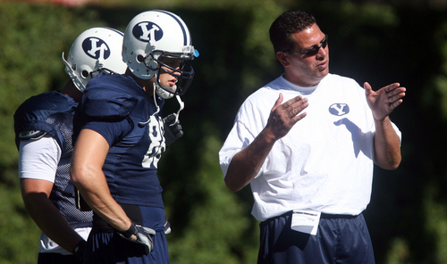 Tribune file photo
Robert Anae, seen at a team practice in 2006, is back as BYU's offensive coordinator and is installing an uptempo attack as the Cougars prepare for the 2013 season.