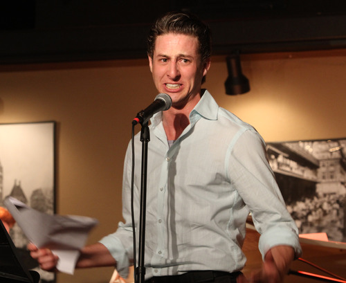 Rick Egan  | The Salt Lake Tribune 

Rhett Guter talks to the crowd during the R.E.A.C.H. Cabaret at the Grind Coffee House in Cedar City, Friday, July 19, 2013.