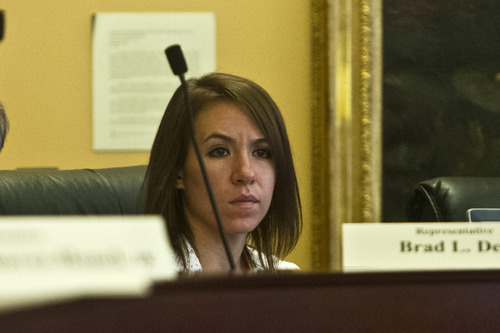 Chris Detrick  |  The Salt Lake Tribune
Samantha Coombs, legislative secretary, listens during a special House committee investigating Attorney General John Swallow at the Utah State Capitol Tuesday August 6, 2013.