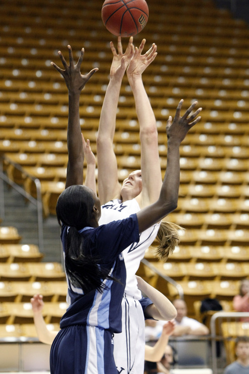 Chris Detrick  |  The Salt Lake Tribune
Brigham Young Cougars center Jennifer Hamson (5) and San Diego Toreros forward Sophia Ederaine (12) go up for a rebound during the second half of the game at the Marriott Center Thursday February 7, 2013. BYU won the game 53-48.