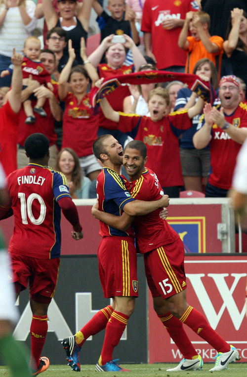 Steve Griffin | The Salt Lake Tribune

Real Salt Lake's Chris Wimgert, left, hugs Alvaro Saborio after Saborio scored the games first goal during first half action of the RSL vs. Portland U.S. Open Cup semifinals soccer game at Rio Tinto Stadium in Sandy, Utah Wednesday August 7, 2013.