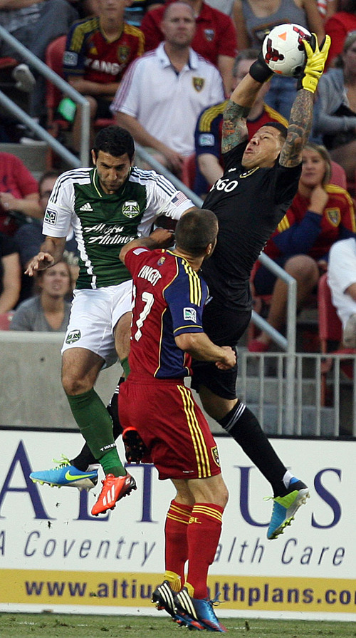 Steve Griffin | The Salt Lake Tribune

Real Salt Lake goal keeper Nick Rimando leaps into the air to grab a shot during first half action of the RSL vs. Portland U.S. Open Cup semifinals soccer game at Rio Tinto Stadium in Sandy, Utah Wednesday August 7, 2013.