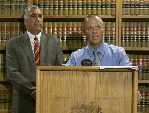 Rick Egan  | The Salt Lake Tribune 
Salt Lake County District Attorney Sim Gill (left) listens as Mike Powell, West Valley Police (right) talks about the findings of the investigation into the Danielle Willard fatal shooting, Thursday, August 8, 2013.