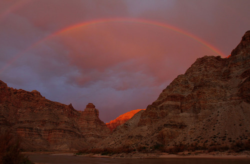 Francisco Kjolseth  |  The Salt Lake Tribune
A double rainbow and epic morning light greet the river party for the last day of a float down Cataract Canyon before entering Lake Powell in July 2012.