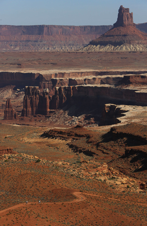 Francisco Kjolseth  |  The Salt Lake Tribune
Mountain bikers ride the White Rim trail in Canyonlands National Park toward Candlestick Tower in May 2013.
