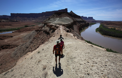 Francisco Kjolseth  |  The Salt Lake Tribune
Hikers return to their mountain bikes after visiting the Fort Bottom ruins along the Green River along the White Rim Trail in Canyonlands National Park in May 2013.