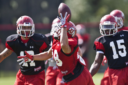 Chris Detrick  |  The Salt Lake Tribune
Utah's Phil Hinson (28) can't make a catch during a practice at the University of Utah Wednesday August 7, 2013.