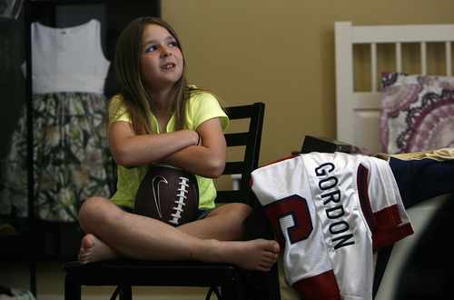 Scott Sommerdorf   |  The Salt Lake Tribune
Sam Gordon contemplates a question about her future in her room, Wednesday, May 15, 2013. Gordon, who's now 10, became famous as a girl playing football against boys.