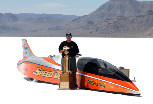 Rick Egan   |  The Salt Lake Tribune

George Poteet stands by his car "Speed Demon" along with the Hot Rod Magazine Trophy, at the Bonneville Salt Flats, Thursday, August 18, 2011. The Speed Demon's top speed was 427 mph.