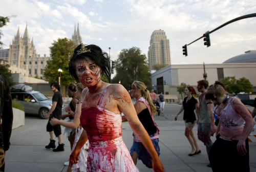 Kim Raff | The Salt Lake Tribune
People dressed as zombies walk on North Temple during the Salt Lake City Zombie Walk in Salt Lake City in August 2012. The sixth annual SLC Zombie Walk is Sunday.