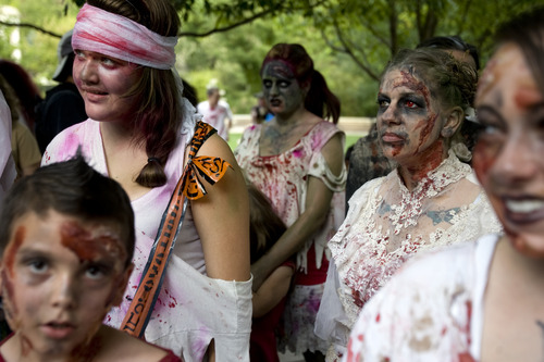 Kim Raff | The Salt Lake Tribune
People dressed as zombies walk on North Temple during the Salt Lake City Zombie Walk in Salt Lake City in August 2012. The sixth annual SLC Zombie Walk is Sunday.