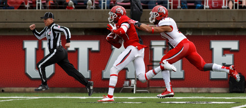 Trent Nelson  |  The Salt Lake Tribune
Dres Anderson pulls in a long pass ahead of Davion Orphey during the University of Utah's Red-White Spring football game, Saturday April 20, 2013 in Salt Lake City.