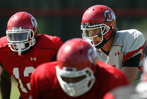 Steve Griffin | The Salt Lake Tribune

University of Utah quarterback, Travis Wilson, calls a play from the line of scrimmage during football practice on the University of Utah baseball field in Salt Lake City, Utah, Friday, Aug. 9, 2013.