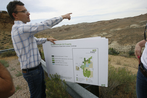 Scott Sommerdorf   |  The Salt Lake Tribune
Mining engineer Ben France gestures towards an area near the White River that shows how the strata of oil shale fits into the geology of the area, Wednesday, August 7, 2013. The Estonian state-owned company Enefit American Oil seeks to develop Utah oil shale.