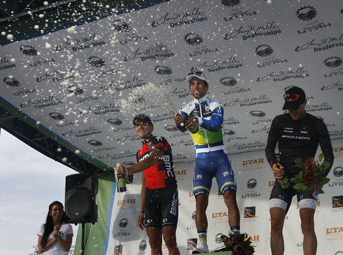 Scott Sommerdorf   |  The Salt Lake Tribune
Winner of Stage 4 of the Tour of Utah, Michael Matthews of Australia, center, sprays the crowd with beer after his win, Friday, August 9, 2013.