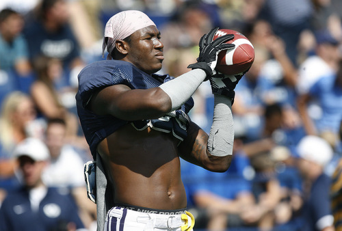 Scott Sommerdorf   |  The Salt Lake Tribune
BYU RB Jamaal Williams warms up with a catching frill prior to scrimmage at LaVell Edwards Stadium, Saturday, August 10, 2013.