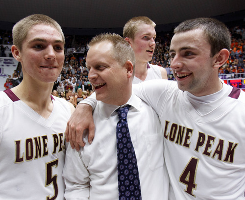 Trent Nelson  |  The Salt Lake Tribune
Lone Peak's Conner Toolson, coach Quincy Lewis, Eric Mika and Nick Emery celebrate after beating Alta High School in the 5A basketball state championship game Saturday, March 2, 2013 in Ogden.