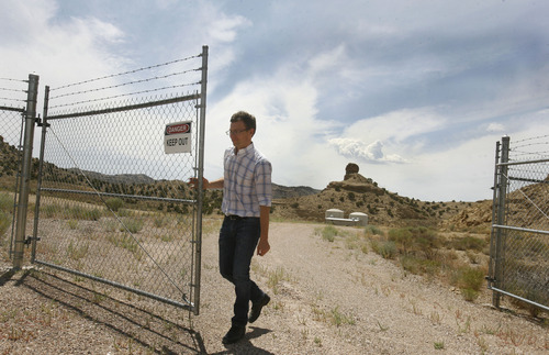 Scott Sommerdorf   |  The Salt Lake Tribune
Enefit mining engineer Ben France opens one of the locked gates to their White River mine on BLM land in eastern Uintah county, Wednesday, August 7, 2013. The mine was developed in the '80s and abandoned in 1985 after the oil price crash. The Estonian state-owned company Enefit American Oil seeks to develop Utah oil shale. Enefit has already excavated tons of ore that has been shipped to Germany for testing.