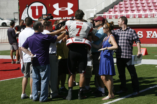 Francisco Kjolseth  |  The Salt Lake Tribune
Quarter back Travis Wilson is surrounded by the mediea following the University of Utah's first preseason scrimmage at the stadium on Tuesday, August 13, 2013.