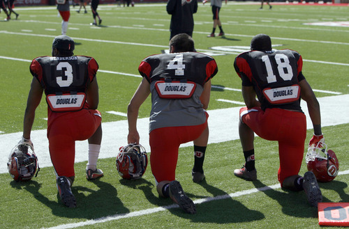 Francisco Kjolseth  |  The Salt Lake Tribune
Charles Henderson, Brian Blechen and Eric Rowe, from left, wait their turn as the University of Utah's football team holds their first preseason scrimmage at the stadium on Tuesday, August 13, 2013.