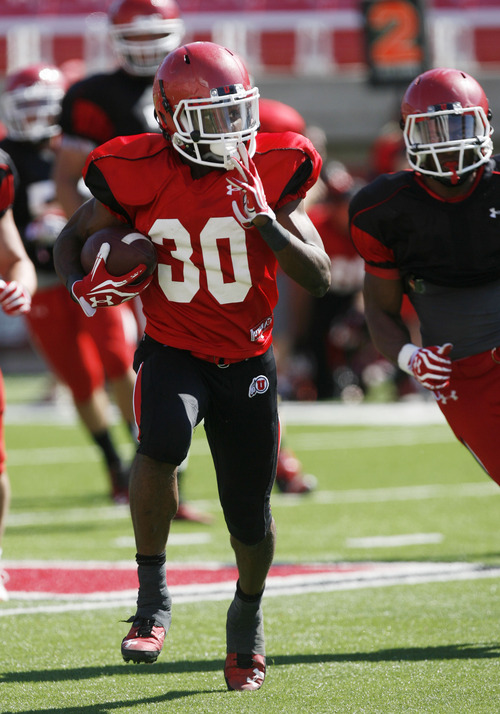 Francisco Kjolseth  |  The Salt Lake Tribune
Dre'Vian Young moves through the field as the University of Utah's football team holds their first preseason scrimmage at the stadium on Tuesday, August 13, 2013.