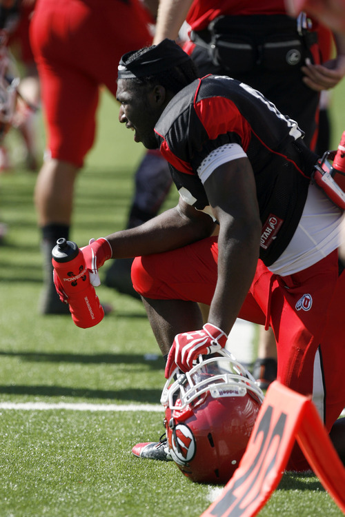 Francisco Kjolseth  |  The Salt Lake Tribune
Brian Walker stays hydrated as he waits his turn as the University of Utah's football team holds their first preseason scrimmage at the stadium on Tuesday, August 13, 2013.