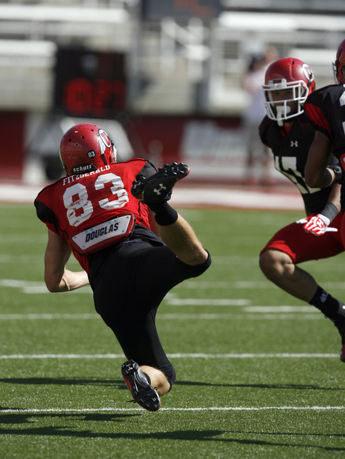 Francisco Kjolseth  |  The Salt Lake Tribune
Sean Fitzgerald tries to reach for a pass as the University of Utah's football team holds their first preseason scrimmage at the stadium on Tuesday, August 13, 2013.