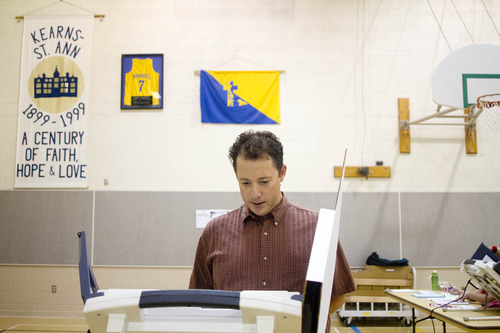 Jeremy Harmon  |  The Salt Lake Tribune

Seth Horowitz votes at the Kearns-St. Ann Catholic school in Salt Lake City on Tuesday, August 13, 2013.