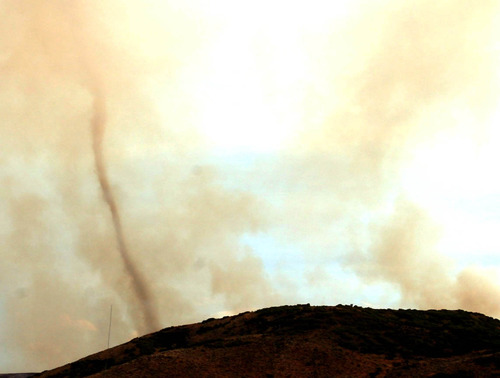 Steve Griffin | The Salt Lake Tribune

Smoke from the Rockport 5 Fire swirls into a giant funnel near Wanship Tuesday August 13, 2013.