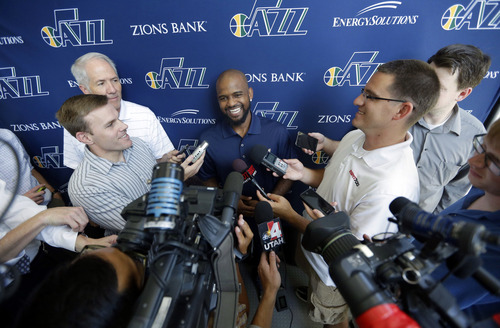 Utah Jazz's John Lucas lll, addresses the media Monday, July 22, 2013, in Salt Lake City. The Utah Jazz have signed free agent guard John Lucas III, who played last season with the Toronto Raptors. The 5-foot-11 guard averaged 5.3 points and 1.7 assists in 13.1 minutes in a career-high 63 games last season, his fifth in the NBA. Lucas, who has also played in Houston and Chicago, has career averages of 5.1 points, 1.5 assists and 1.0 rebounds in 11.8 minutes. He is the son of former NBA coach and player John Lucas Jr., the No. 1 pick in the 1976 NBA draft. (AP Photo/Rick Bowmer)
