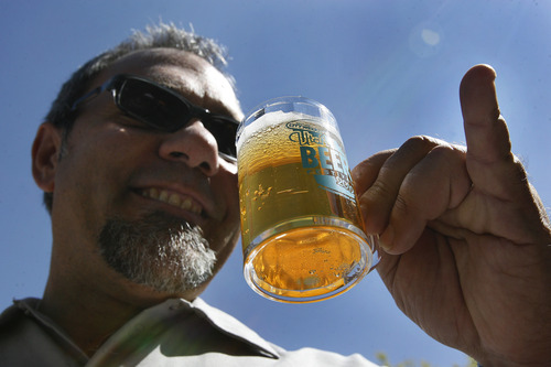 Scott Sommerdorf  |  The Salt Lake Tribune             
Mike Riedel playfully sticks out his pinky finger while preparing to sip from the tiny 4 ounce glasses at the Utah Beer Festival at The Galivan Center, Sunday, August 26, 2012.