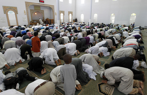 Al Hartmann  |  The Salt Lake Tribune
Utah Muslims gather to pray at the Khadeeja Islamic Center in West Valley City on Thursday, Aug. 8, to celebrate the end of their monthlong fast for Ramadan.