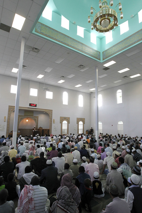 Al Hartmann  |  The Salt Lake Tribune
Utah Muslims gather to pray at the Khadeeja Islamic Center in West Valley City on Thursday, Aug. 8, to celebrate the end of their monthlong fast for Ramadan.