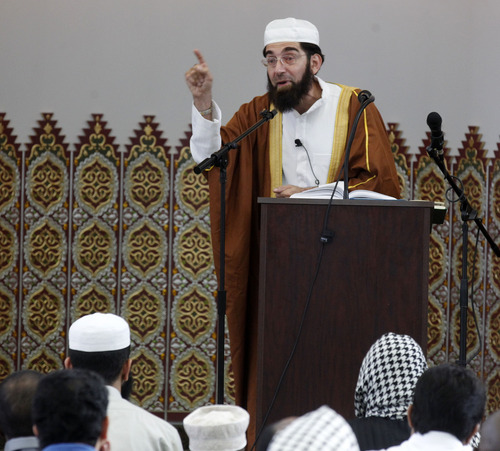 Al Hartmann  |  The Salt Lake Tribune
Imam Mohamed Shoayb Mehter leads Utah Muslims in prayers at the Khadeeja Islamic Center Mosque in West Valley City Thursday August 8 to celebrate the end of their month-long fast for Ramadan.