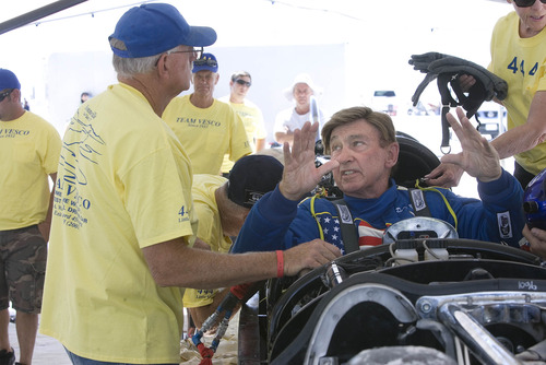 Paul Fraughton  |   Salt Lake Tribune
  Rick Vesco talks with driver Dave Spangler as the team makes minor adjustments before their run.   A safety issue kept the car from making its run today.                       
 Tuesday, August 13, 2013