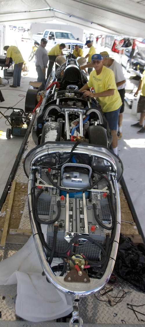 Paul Fraughton  |   Salt Lake Tribune
  Team Vesco works on The Turbinator in preparation for its run on the flats.                          
 Tuesday, August 13, 2013