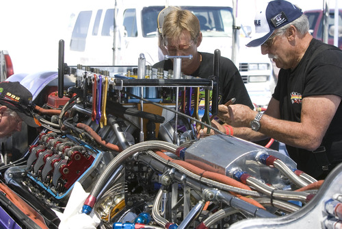 Paul Fraughton  |   Salt Lake Tribune
   Nish Motorsport's Royal Purple  is worked on in the team's pit area.                        
 Tuesday, August 13, 2013