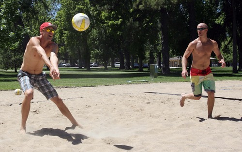 Rick Egan  | The Salt Lake Tribune 

Jake Gibb (left) plays volleyball along with Derran Cannon (right) at Liberty Park, Wednesday, June 5, 2013. Gibb is promoting the AVP Pro Beach Volleyball Tour coming to Utah in August.