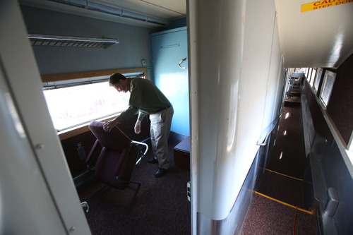 Francisco Kjolseth  |  The Salt Lake Tribune
Gerry Lemmons, private rail car tour consultant and private chef shows off one of the fold away beds inside the 1948 "Moonlight Dome" rail car but not before folding away a specially made chair allowing for the accomodation.