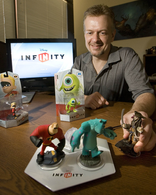Paul Fraughton  |  The Salt Lake Tribune
John Blackburn of Avalanche Software shows off some of the characters from their new game "Disney Infinity," which they hope will make a big splash at next week's video game trade show.         Thursday, June 6, 2013